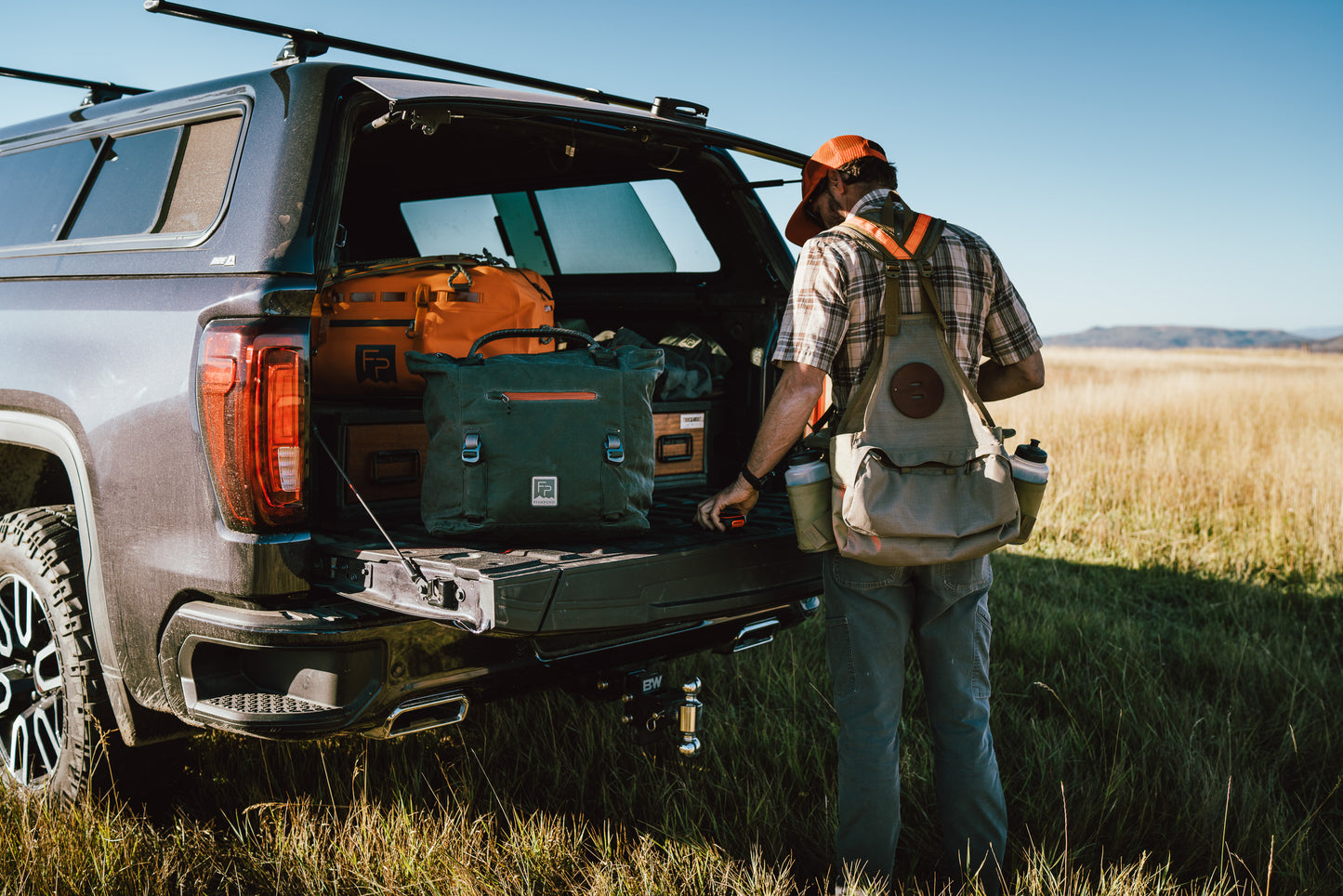 Man loading a truck with FP Field